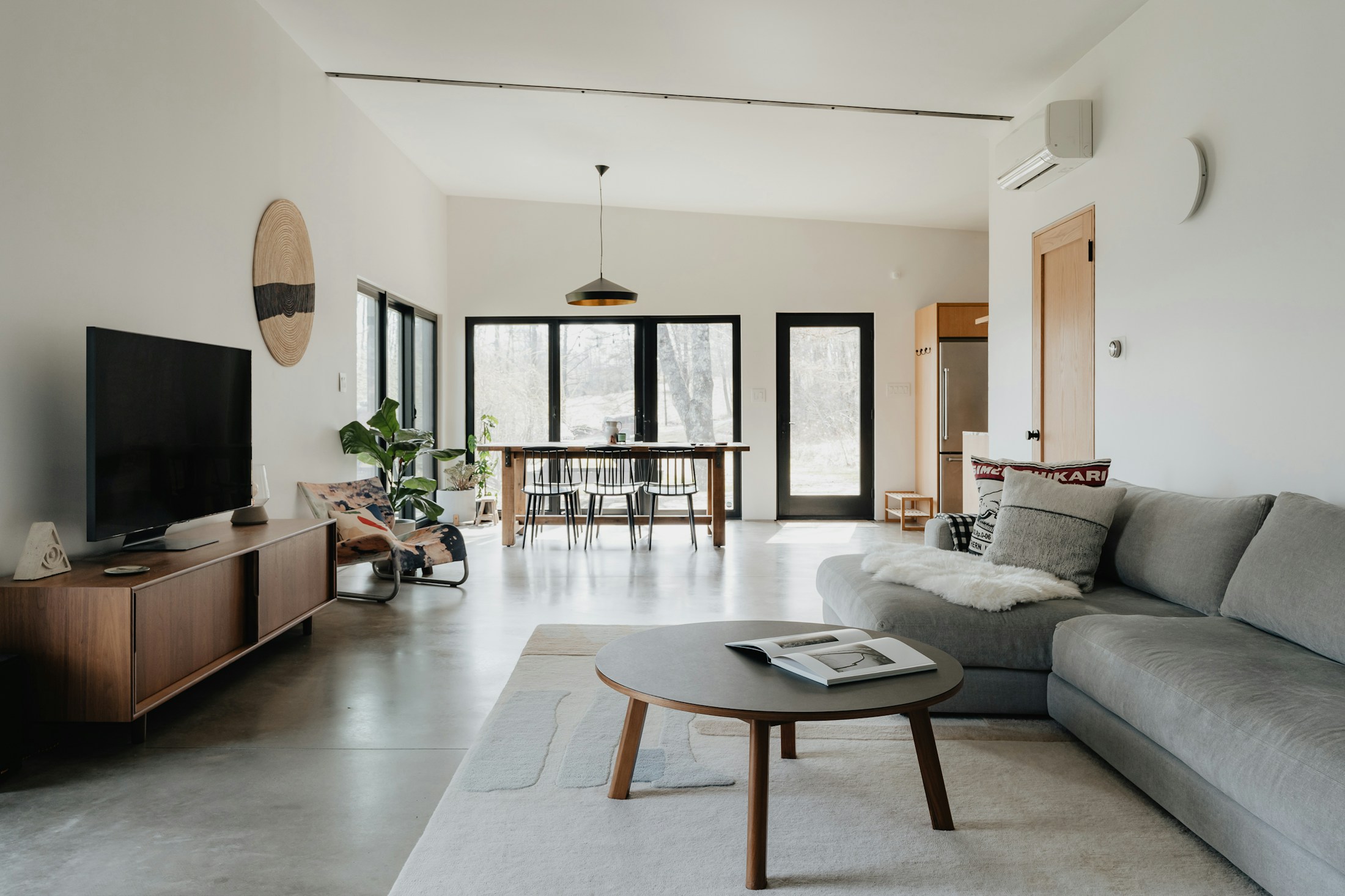 Contemporary living room with a television and thoughtfully integrated entertainment space